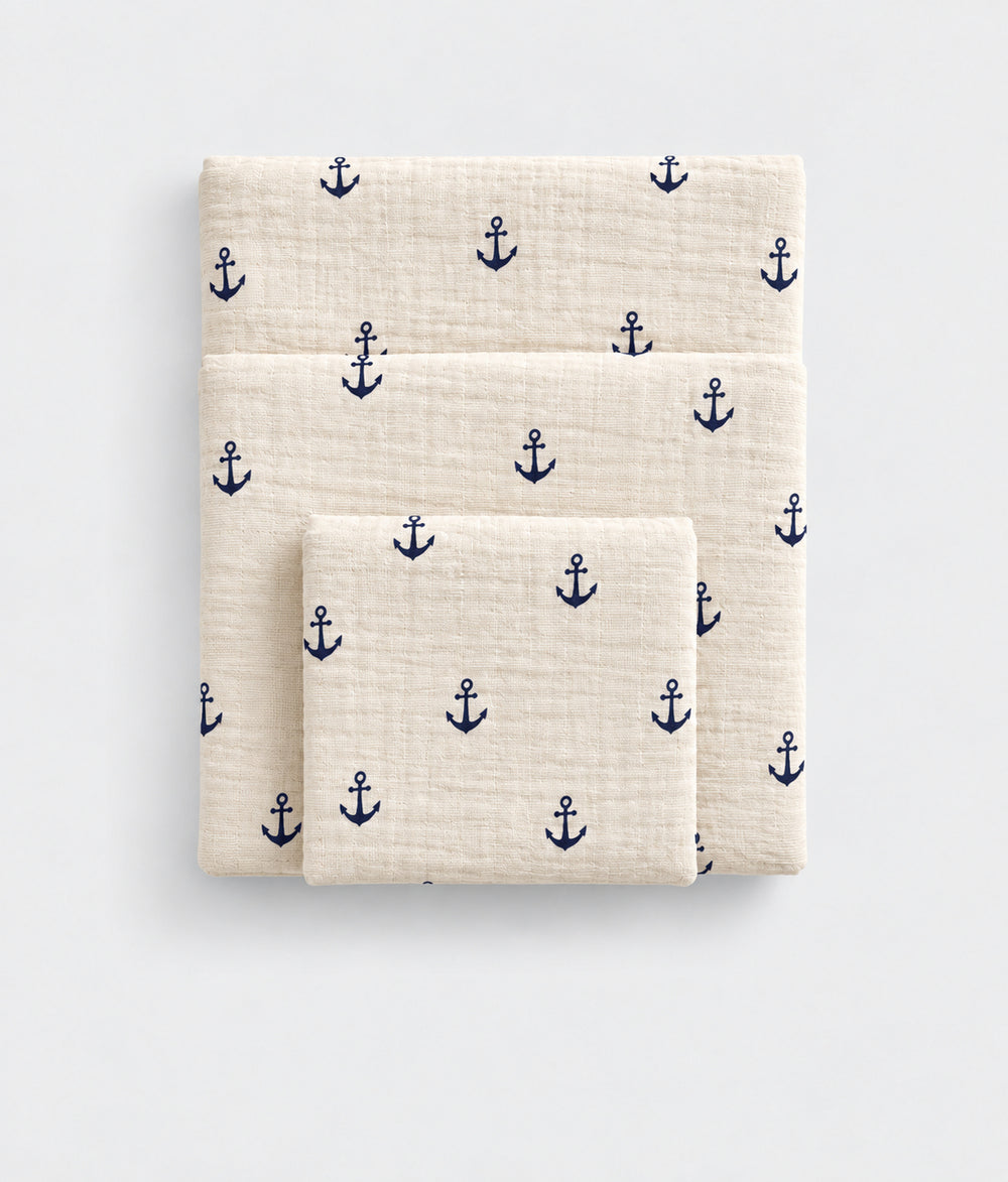 Deep Sea cotton muslin towel, folded, anchor print