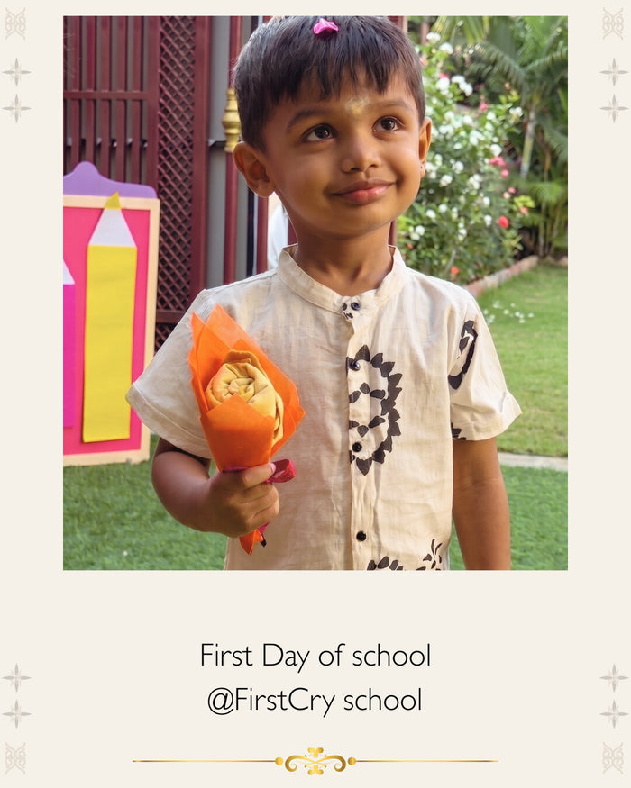 A child's first day of school, honoured with a White Flowerr Vastra Maala