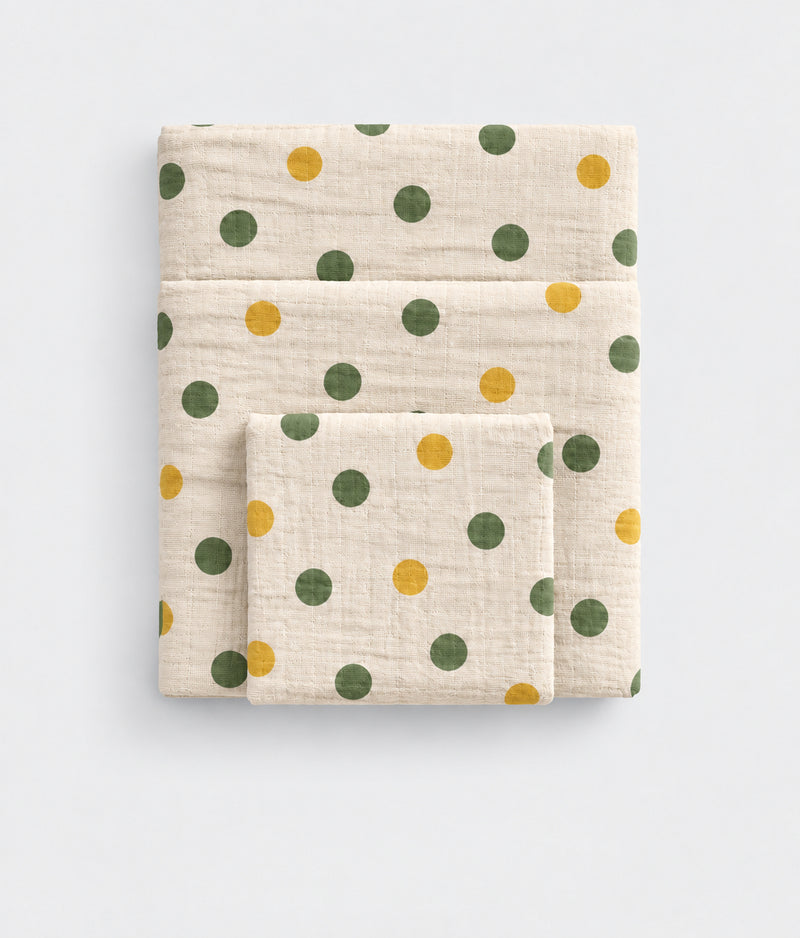 Dream Dot polka dot print cotton muslin towel, folded flat lay, White Flowerr