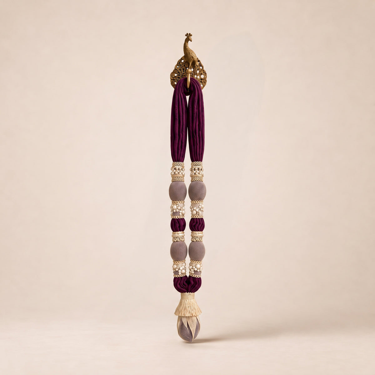 Legacy Maala by White Flowerr, plum and mauve cotton muslin garland on a brass peacock hook