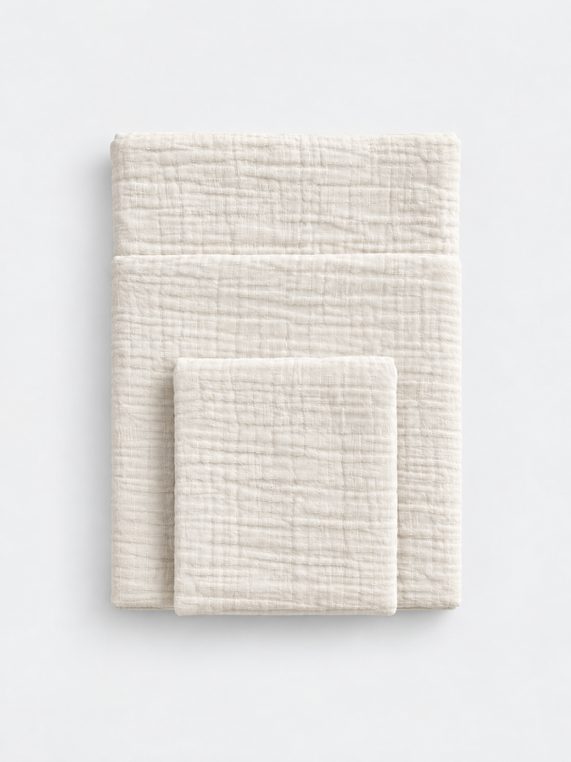 French Vanilla cotton muslin towel colour reference by White Flowerr, showing folded towels in different sizes