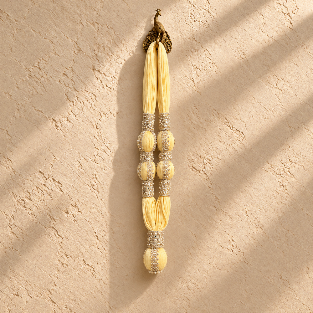 VIP Maala, yellow cotton muslin garland with two decorated towel balls on each side