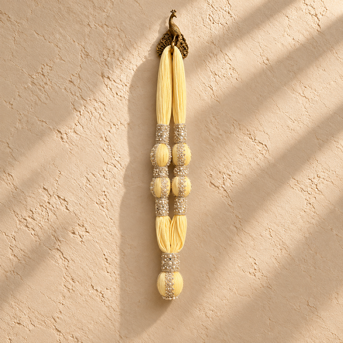 VIP Maala, yellow cotton muslin garland with two decorated towel balls on each side